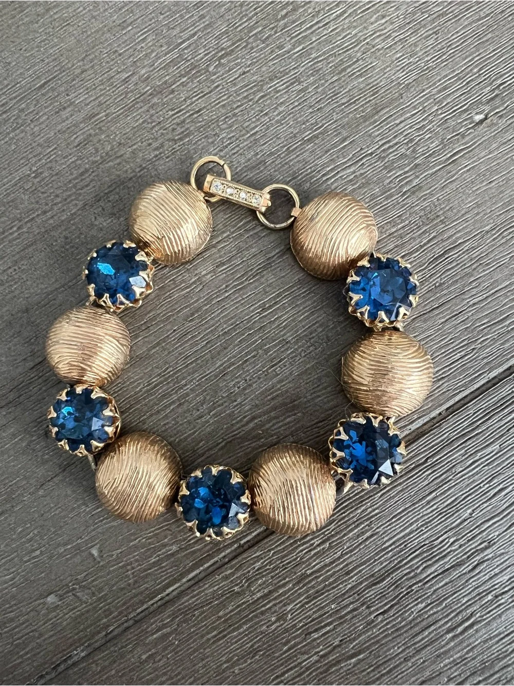 Kramer Gold-Tone Bracelet with Deep Blue Crystal Stations